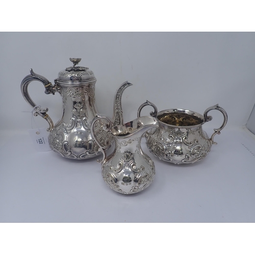 122 - A Victorian silver plated three piece Coffee Service with floral and scroll embossing and chasing, e... 