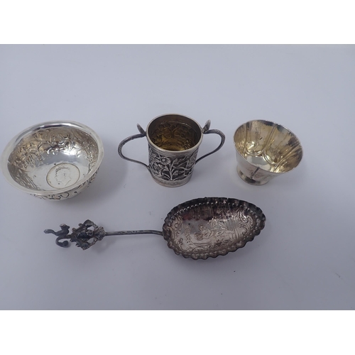 125 - A Continental silver Spoon, the oval bowl with cherub and dove, mask and bird finial, a lobed circul... 