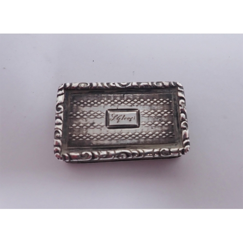 130 - A Victorian silver Vinaigrette with engine turning, leafage scroll pierced grille, Birmingham 1840, ... 