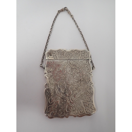 142 - A Victorian silver Card Case with strapwork engraving, initials DH within oval cartouche, Birmingham... 