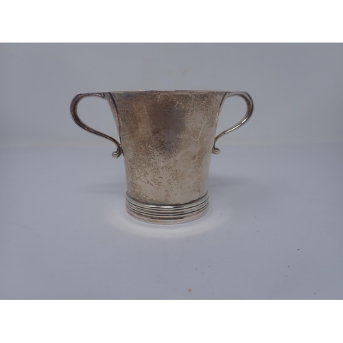 145 - A George V silver two handled Cup of flared form, Dublin 1914, maker: R.B., stamped Harrods, London