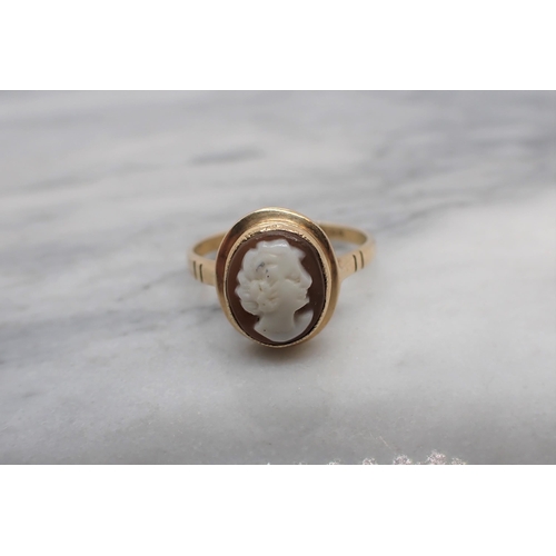 163 - A carved shell Cameo Ring of bust in profile in 9ct gold, ring size N 1/2, approx 2.40gms