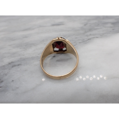 187 - A Garnet Ring claw-set step-cut stone in 9ct gold, ring size S