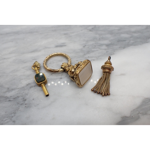 188 - A yellow metal Fob set onyx, a yellow metal Tassel Fob and a Watch Key set bloodstone and cornelian