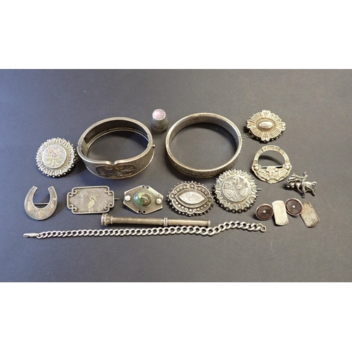 197 - A collection of Victorian silver and white metal Brooches, two hinged Bangles, pair of Cufflinks, wh... 