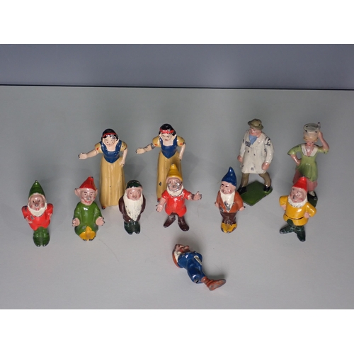 201 - Two Britains die-cast Figures; milkmaid and farmer, a set of Snow White and the Seven Dwarfs die-cas... 