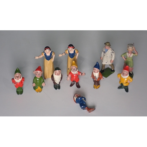 201 - Two Britains die-cast Figures; milkmaid and farmer, a set of Snow White and the Seven Dwarfs die-cas... 