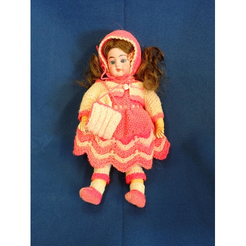 202 - An early 20th Century German Schoenau and Hoffmeister bisque headed Doll with sleeping eyes, open mo... 