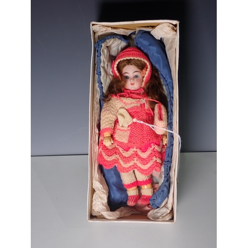 202 - An early 20th Century German Schoenau and Hoffmeister bisque headed Doll with sleeping eyes, open mo... 