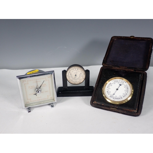 206 - An Asprey Pocket Barometer on stand, a Smith's Barometer and a German travelling Barometer