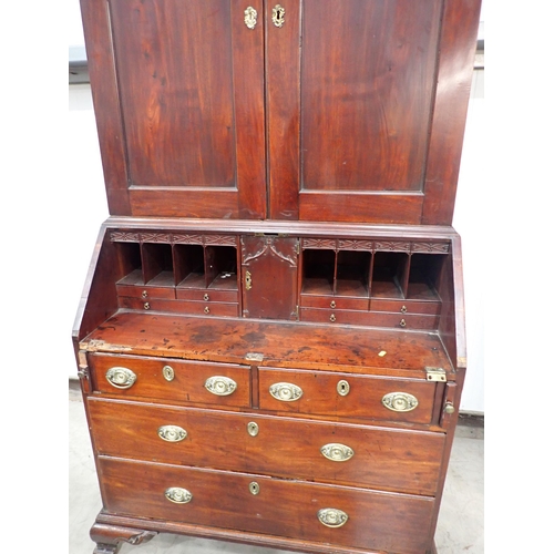 21 - A George III mahogany Bureau Bookcase with fret carved frieze above pair of fielded panel doors and ... 