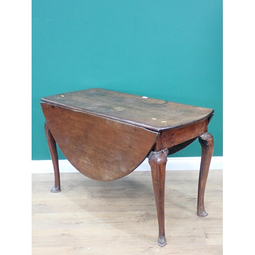 23 - An 18th Century oak dropleaf Table on cabriole supports 3ft 10in W x 2ft 4in H