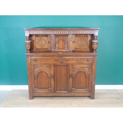 303 - A reproduction oak Court Cupboard fitted with four arcaded panel doors 4ft 8in H x 4ft 5in W