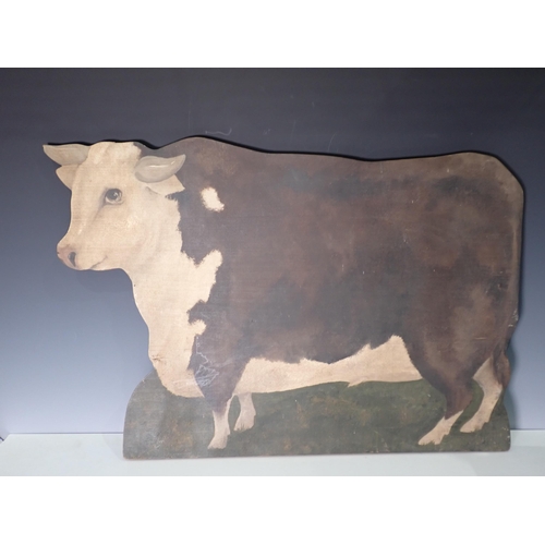 310 - An antique carved and painted Rocking Horse Head, a painted Screen in the form of a Hereford Cow and... 