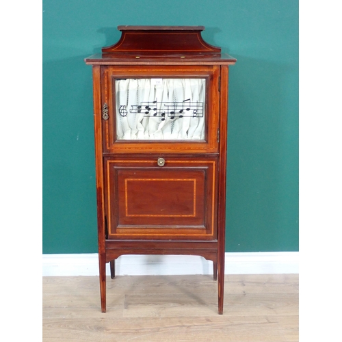 330 - An Edwardian mahogany and inlaid Music Cabinet fitted glazed door above pull out divided compartment... 