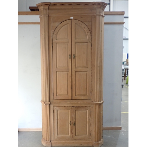 337 - A George III pine standing Corner Cupboard fitted pair of arched panelled doors above pair of cupboa... 