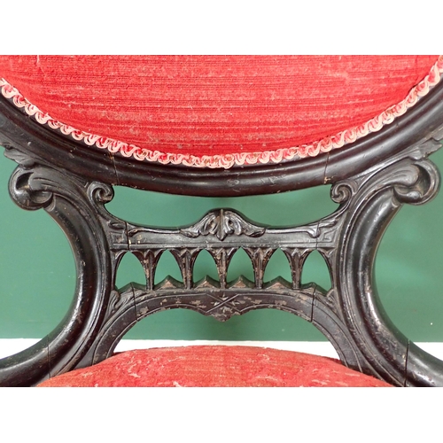 339 - A Victorian ebonised Nursing Chair with red upholstery