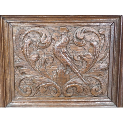 358 - A 17th Century carved oak Panel of a bird amongst scrolled foliage 12in W x 10in H