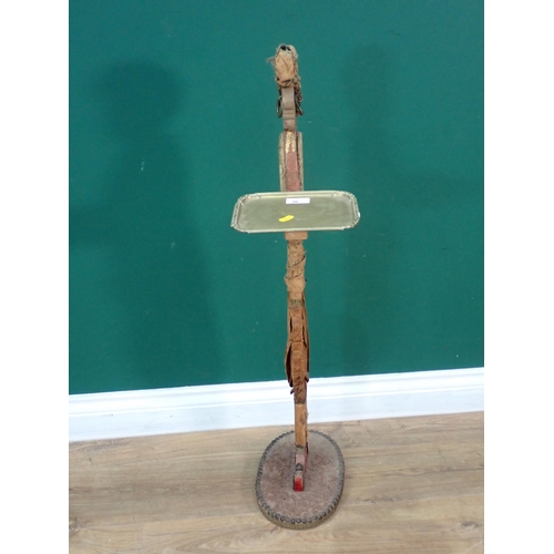 36 - An antique Drinks Stand in the form of a Moorish butler in Regency dress with brass tray 3ft H