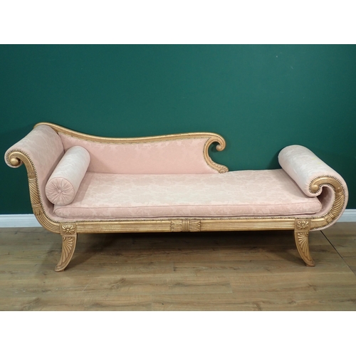 369 - A Regency style gilded Chaise Lounge with scroll arm and footboard and pink floral upholstery mounte... 