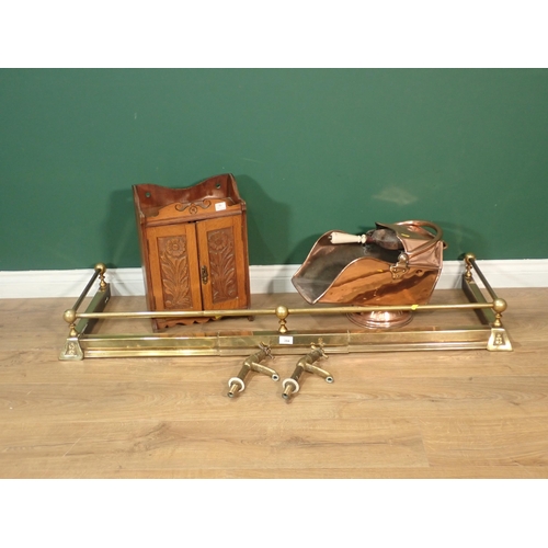 394 - A carved oak Smoking Cabinet, a copper Coal Scuttle, a brass Fire Curb and a pair of brass Taps