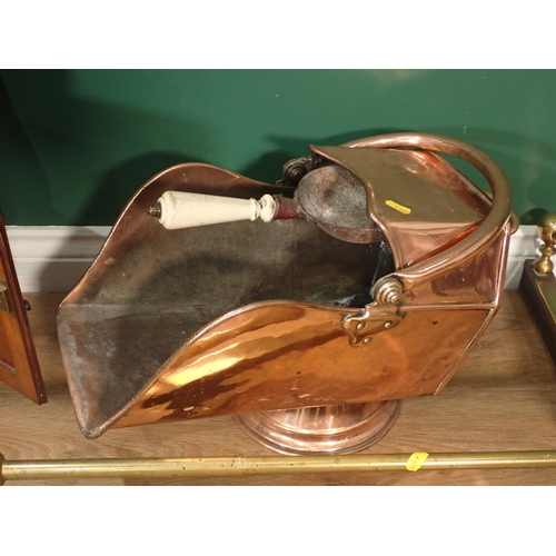 394 - A carved oak Smoking Cabinet, a copper Coal Scuttle, a brass Fire Curb and a pair of brass Taps