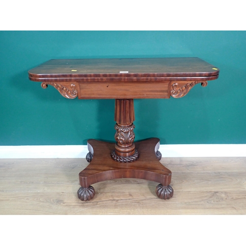 400 - A William IV mahogany fold over Tea Table on gadrooned and floral carved column and quadruple platfo... 