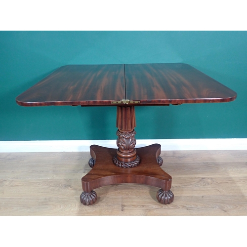 400 - A William IV mahogany fold over Tea Table on gadrooned and floral carved column and quadruple platfo... 