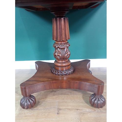 400 - A William IV mahogany fold over Tea Table on gadrooned and floral carved column and quadruple platfo... 