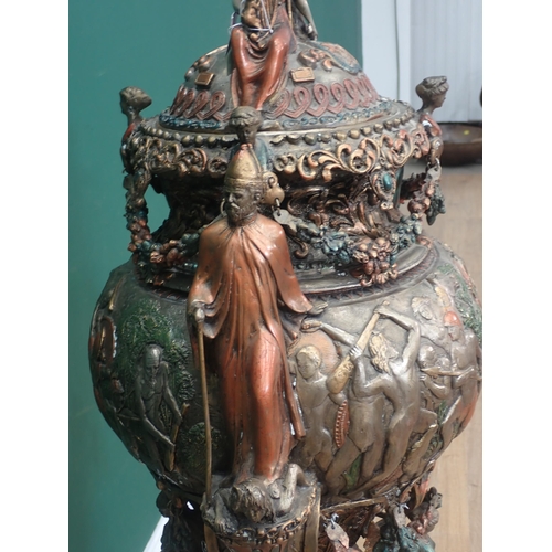 472 - A large bronze effect Urn in the Roman style with figures of gods and warriors and swag decoration 4... 