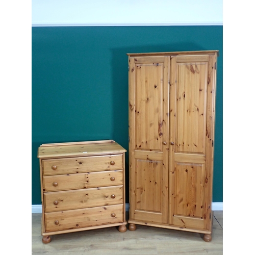 476 - A modern pine Chest of four drawers 3ft 1in H x 2ft 11in W and a matching two door Wardrobe 6ft 2in ... 