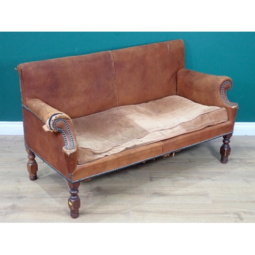 515 - A 19th Century leather upholstered child's Settee on turned and square cut supports A/F 4ft 2in W x ... 