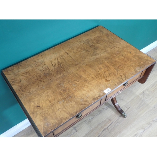 520 - A walnut veneered Sofa Table fitted two frieze drawers mounted upon cheval base with brass paw caste... 