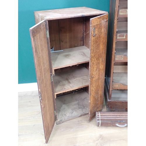 541 - An oak tambour fronted Music Cabinet A/F 3ft 10in H x 1ft 7in W and an oak two door Cupboard 3ft 1in... 