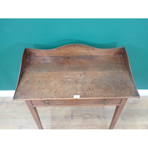 543 - A Georgian oak Wash Stand with shaped back fitted single frieze drawer mounted upon square cut taper... 