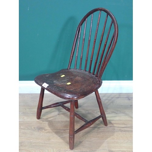 544 - An antique child's spindle back Chair labelled 