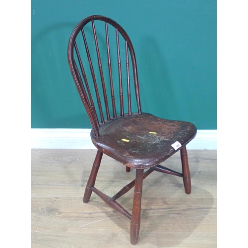 544 - An antique child's spindle back Chair labelled 