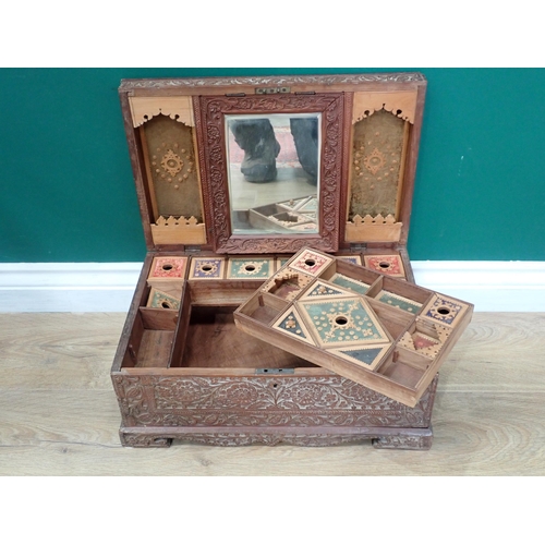 549 - An Anglo-Indian sandalwood carved Dressing Box with fitted interior and dressing mirror 1ft 5in W x ... 