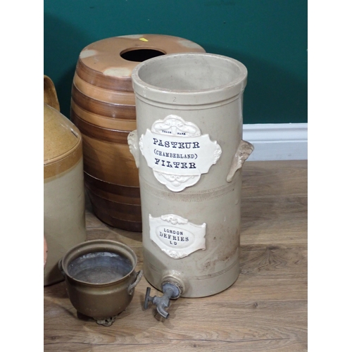 555 - A glazed Butter Barrel, a ceramic Water Purifier, two stoneware Barrels, a large stoneware Bowl and ... 