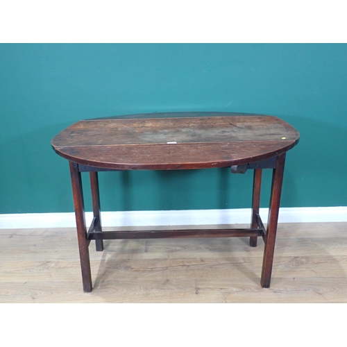 557 - An antique oak oak oval dropleaf Dining Table mounted on square cut supports 3ft 9in W x 2ft 6in H