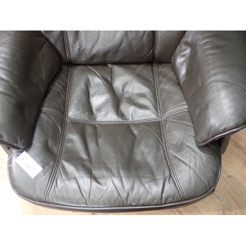 558 - A brown leather effect swivel Easy Chair and Foot Stool