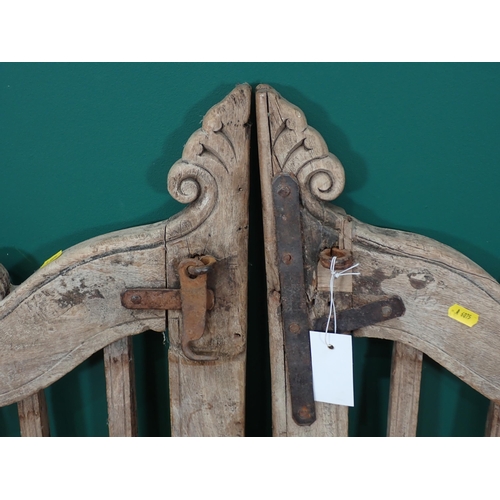 563 - A pair of hardwood Garden Gates with carved bird design, each 3ft 10in H x 1ft 8in W