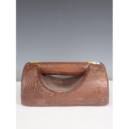 566 - A carved teak Doorstop