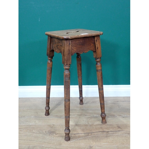 573 - An antique Milking Stool on turned supports 1ft 11in H x 10in W