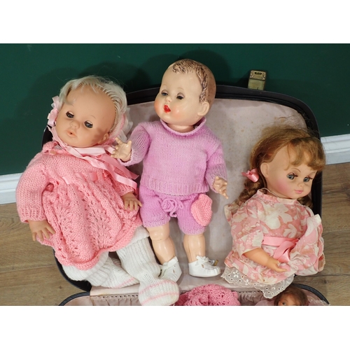 577 - A suitcase containing various Dolls