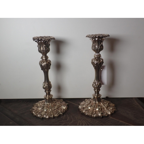 596 - A pair of silver plated Candlesticks bearing maker's mark, 10in H, a plated Bottle Holder with soda ... 