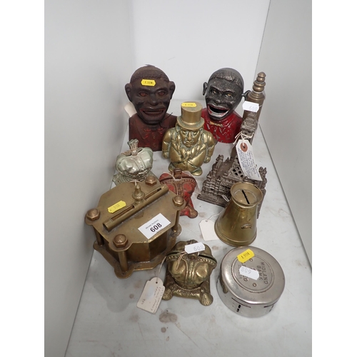 608 - Two figural Money Boxes, a brass bedpost type Money Box, a cast-iron Blackpool Tower Money Bank, a b... 