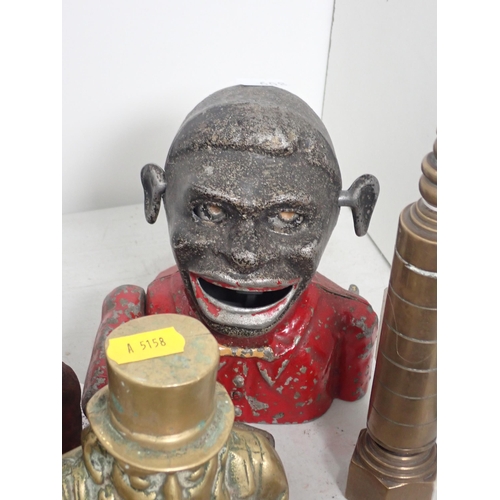 608 - Two figural Money Boxes, a brass bedpost type Money Box, a cast-iron Blackpool Tower Money Bank, a b... 