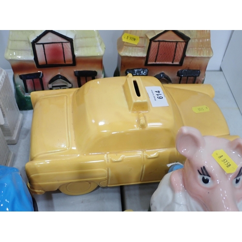 614 - A quantity of Money Boxes and Piggy Banks including three Wade Piggy Banks, a cottage spongeware Mon... 