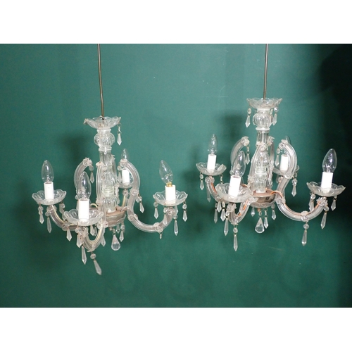 637 - A pair of glass four-branch Candelabra and a brass and glass graduated Light Fitting